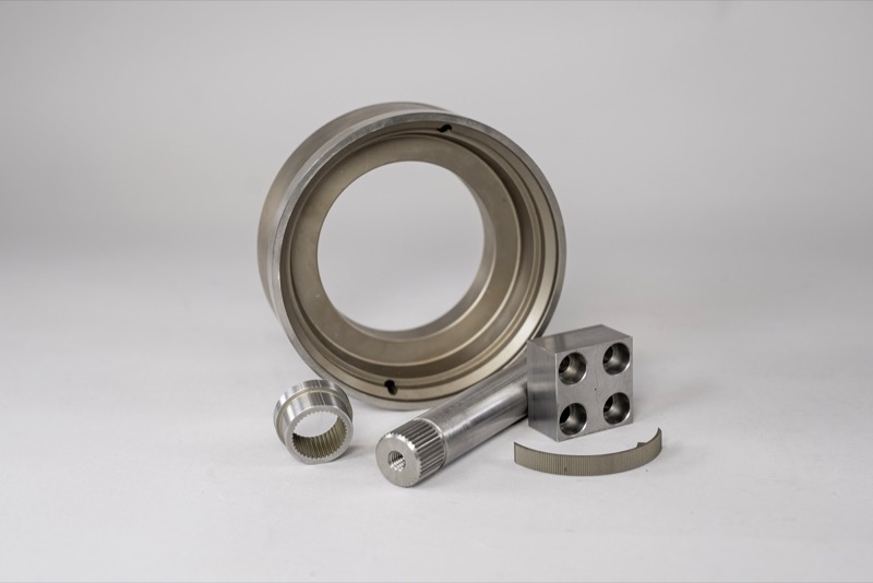 Assorted precision-machined prototype parts in steel and aluminum